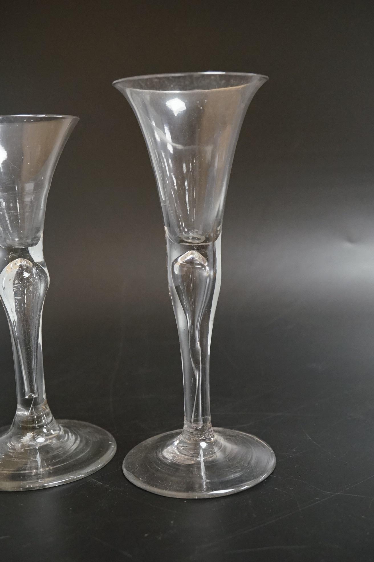 Two drawn wine glasses, each with air-tear stems, and a drawn-stem wine glass with blue internal twist, tallest 17cm high (3)